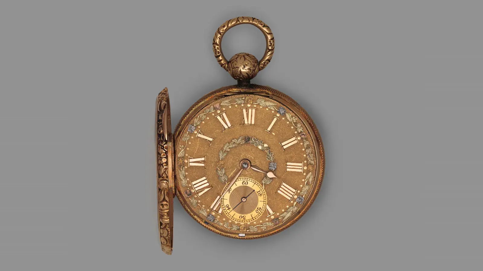 A gold pocket watch from 1820, its front cover open on a gold dial with Roman numerals, a floral wreath and a seconds subdial